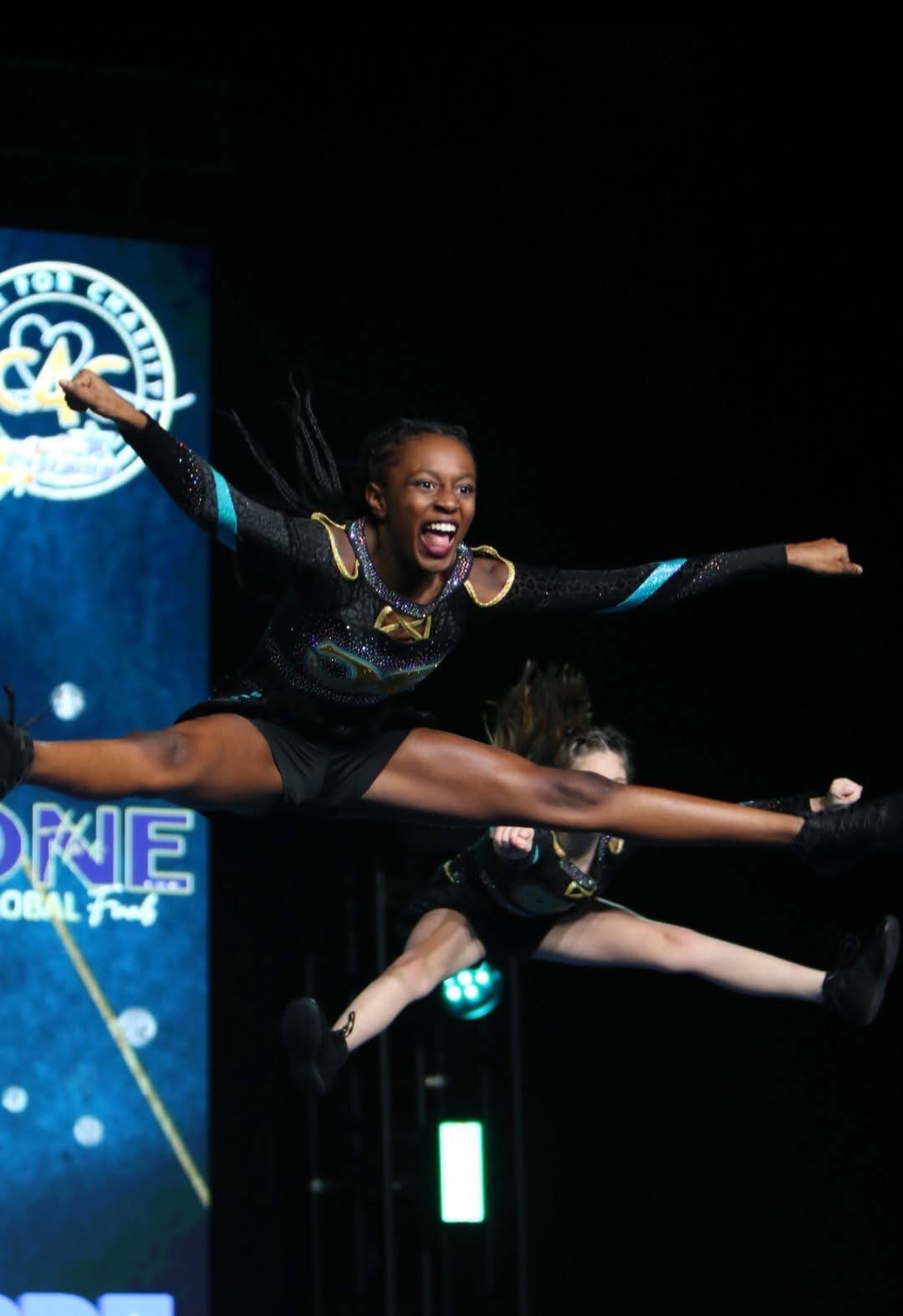 Chesapeake Elite athlete performing an airborne split